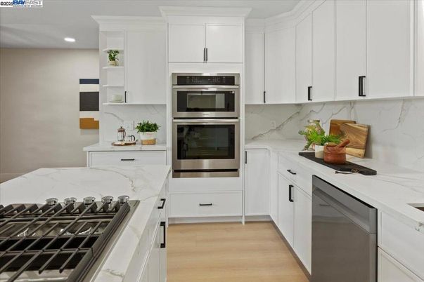 Interior, Kitchen, Marble Walls, Recessed Lighting, Stainless Steel Appliances, Wood Texture Flooring