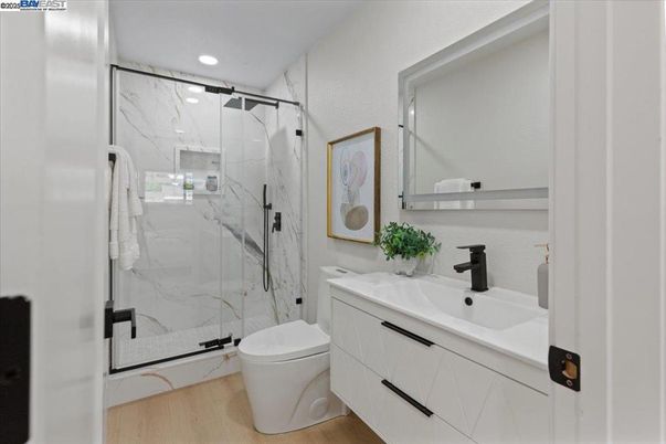 Bathroom, Glass Shower, Interior, Marble Walls, Recessed Lighting, Wood Texture Flooring