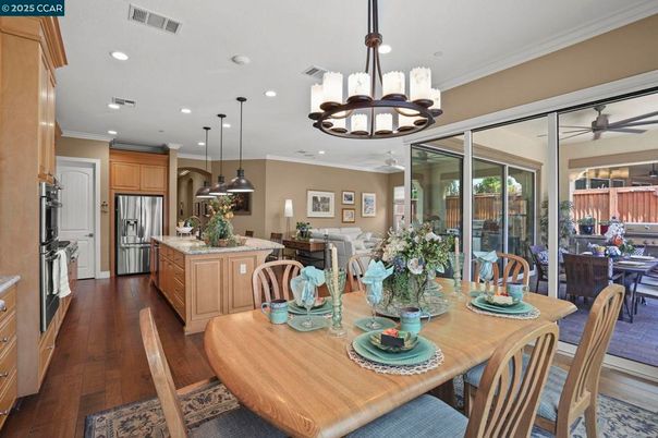 Chandelier, Dining room, Interior, Kitchen, Pendant Lights, Recessed Lighting, Stainless Steel Appliances, Wood Texture Flooring
