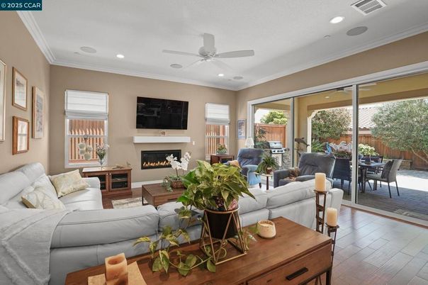 Dining room, Fireplace, Interior, Living room, Recessed Lighting, Wood Texture Flooring