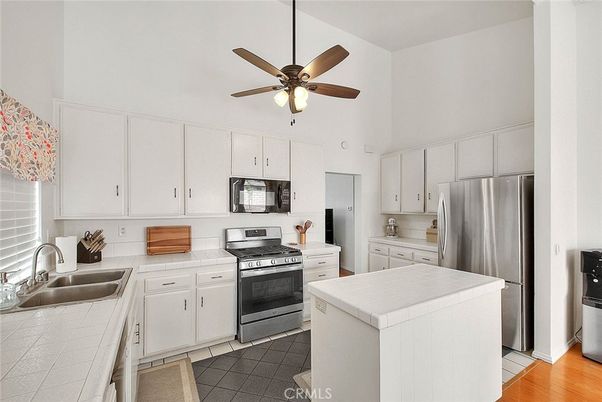Interior, Kitchen, Stainless Steel Appliances, Tile Countertops, Wood Texture Flooring