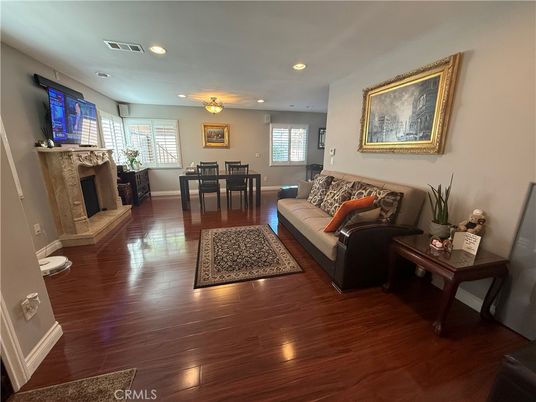 Dining room, Fireplace, Interior, Living room, Recessed Lighting, Wood Texture Flooring