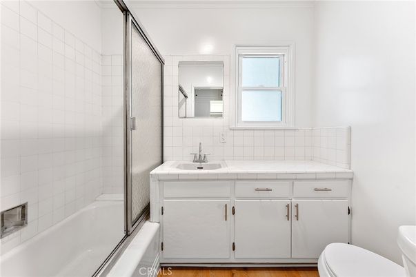 Bathroom, Glass Shower, Interior, Tile Countertops, Wood Texture Flooring
