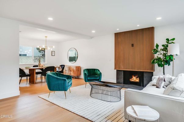 Chandelier, Dining room, Fireplace, Interior, Living room, Pendant Lights, Recessed Lighting, Wood Texture Flooring