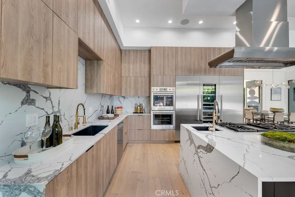 Interior, Kitchen, Marble Walls, Pendant Lights, Recessed Lighting, Stainless Steel Appliances, Wood Texture Flooring