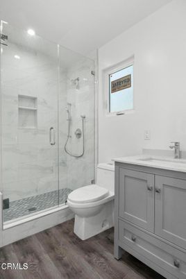 Bathroom, Glass Shower, Interior, Marble Walls, Recessed Lighting, Wood Texture Flooring