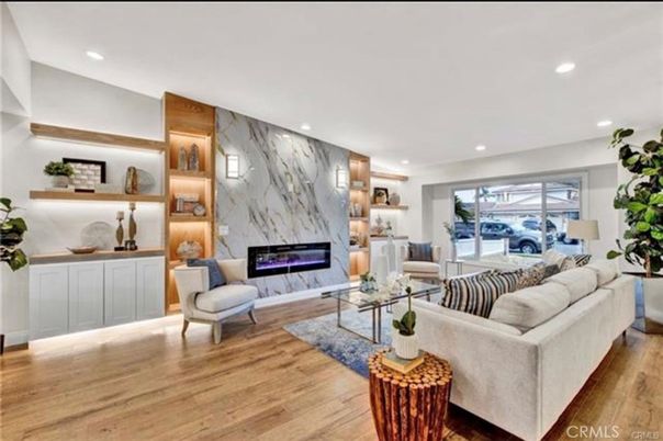 Fireplace, Interior, Living room, Marble Walls, Recessed Lighting, Wood Texture Flooring