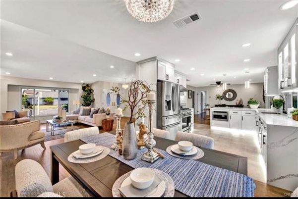 Chandelier, Dining room, Interior, Kitchen, Living room, Pendant Lights, Recessed Lighting, Stainless Steel Appliances, Wood Texture Flooring