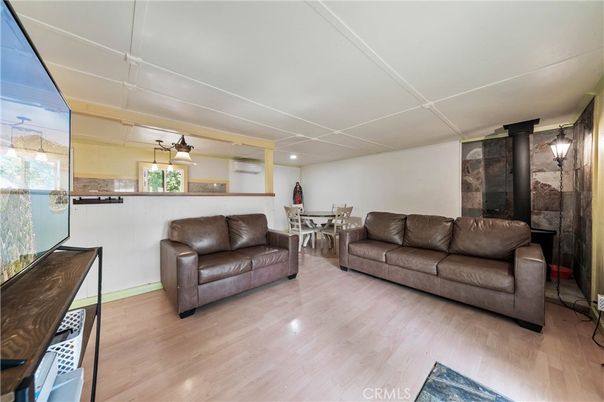 Dining room, Interior, Living room, Recessed Lighting, Stone Walls, Wood Texture Flooring