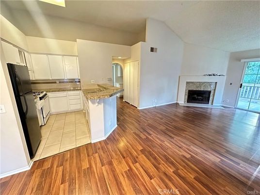 Empty room, Fireplace, Interior, Kitchen, Recessed Lighting, Wood Texture Flooring