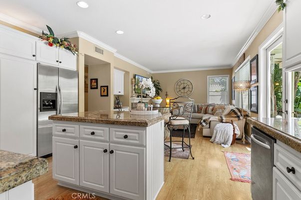 Chandelier, Interior, Kitchen, Living room, Recessed Lighting, Stainless Steel Appliances, Wood Texture Flooring