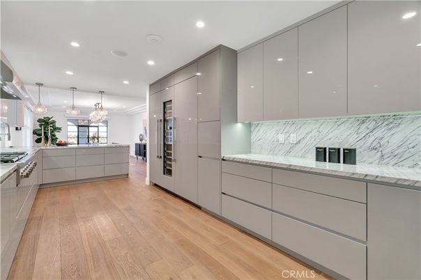 Interior, Kitchen, Marble Walls, Pendant Lights, Recessed Lighting, Stainless Steel Appliances, Wood Texture Flooring