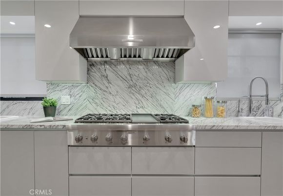 Interior, Kitchen, Marble Walls, Recessed Lighting, Stainless Steel Appliances