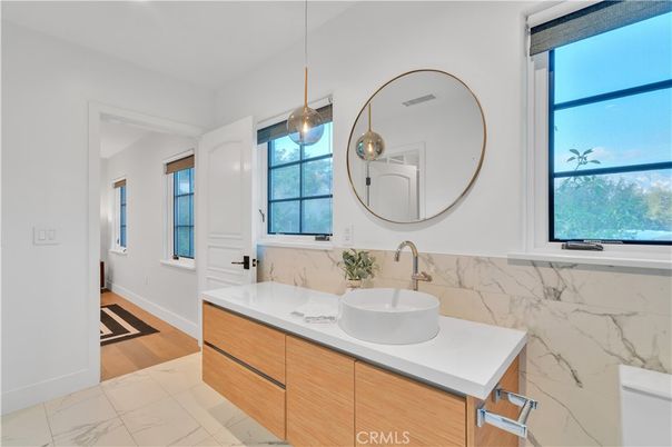 Bathroom, Dual Sink Vanities, Interior, Marble, Marble Walls, Pendant Lights, Wood Texture Flooring