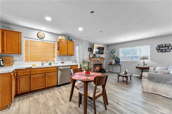 Dining room, Fireplace, Interior, Kitchen, Recessed Lighting, Tile Countertops, Wood Texture Flooring
