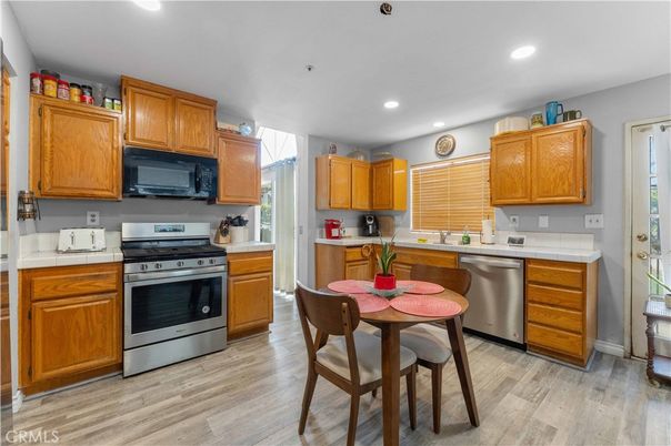 Dining room, Interior, Kitchen, Recessed Lighting, Stainless Steel Appliances, Wood Texture Flooring