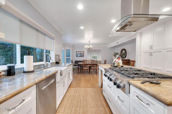 Chandelier, Dining room, Interior, Kitchen, Recessed Lighting, Stainless Steel Appliances, Wood Texture Flooring