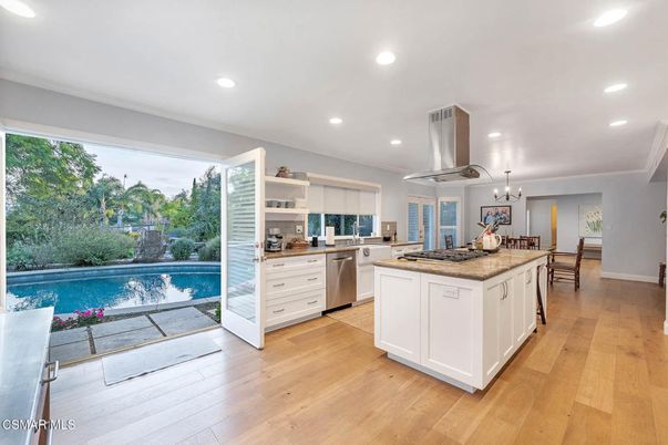 Chandelier, Dining room, Interior, Kitchen, Pendant Lights, Recessed Lighting, Stainless Steel Appliances, Wood Texture Flooring