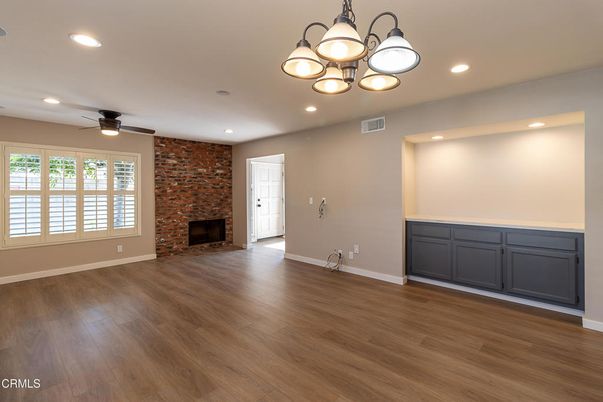 Empty room, Fireplace, Interior, Recessed Lighting, Stone Walls, Wood Texture Flooring