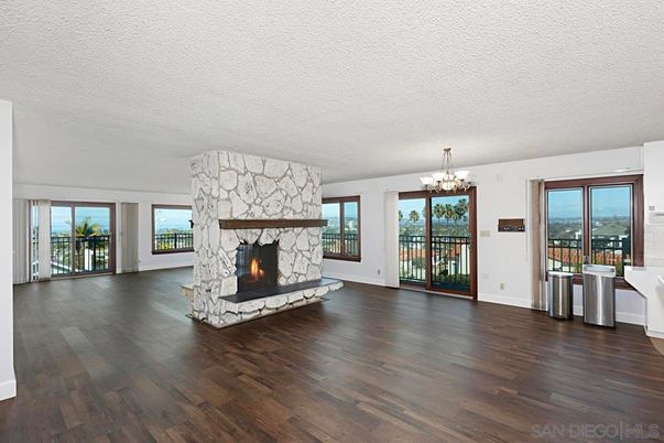 Chandelier, Empty room, Fireplace, Interior, Stone Walls, Wood Texture Flooring