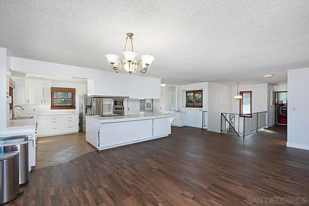 Chandelier, Interior, Kitchen, Pendant Lights, Recessed Lighting, Stainless Steel Appliances, Wood Texture Flooring