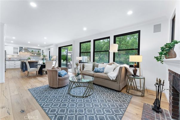 Dining room, Fireplace, Interior, Kitchen, Living room, Recessed Lighting, Stainless Steel Appliances, Wood Texture Flooring