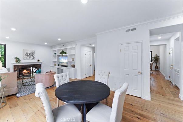 Dining room, Fireplace, Interior, Living room, Recessed Lighting, Wood Texture Flooring