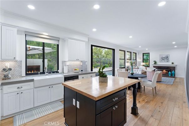 Dining room, Fireplace, Interior, Kitchen, Living room, Recessed Lighting, Stainless Steel Appliances, Wood Texture Flooring