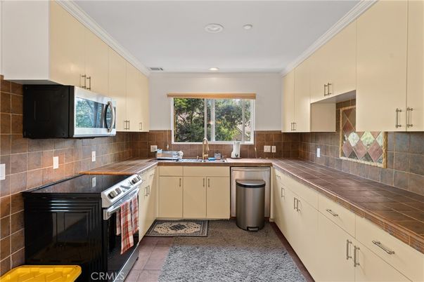 Interior, Kitchen, Recessed Lighting, Stainless Steel Appliances, Tile Countertops
