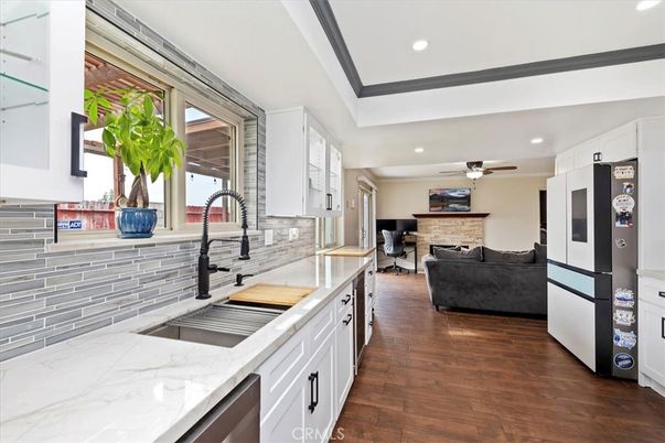 Fireplace, Interior, Kitchen, Living room, Recessed Lighting, Stainless Steel Appliances, Stone Walls, Wood Texture Flooring
