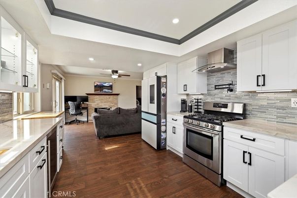 Fireplace, Interior, Kitchen, Living room, Recessed Lighting, Stainless Steel Appliances, Stone Walls, Wood Texture Flooring