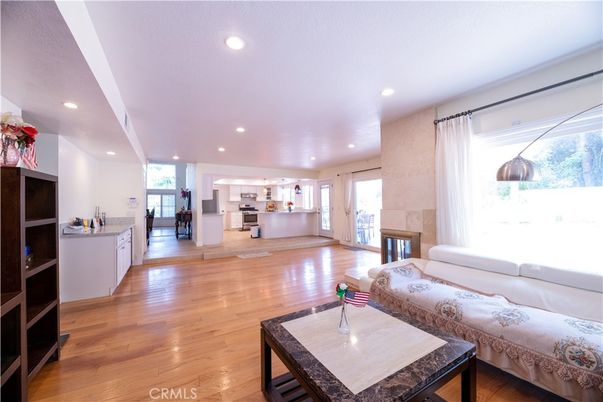 Fireplace, Interior, Kitchen, Living room, Recessed Lighting, Wood Texture Flooring