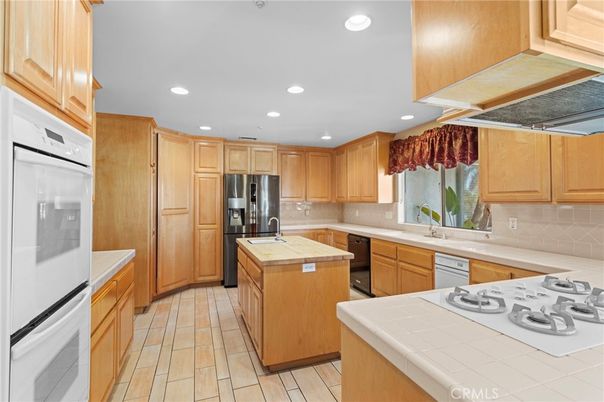 Interior, Kitchen, Recessed Lighting, Stainless Steel Appliances, Tile Countertops, Wood Texture Flooring