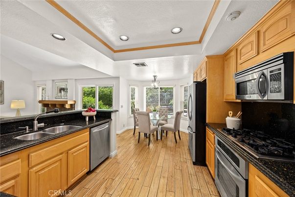 Dining room, Interior, Kitchen, Recessed Lighting, Stainless Steel Appliances, Wood Texture Flooring