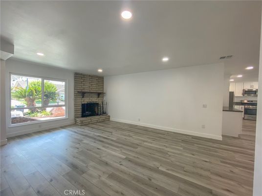 Empty room, Fireplace, Interior, Kitchen, Recessed Lighting, Wood Texture Flooring