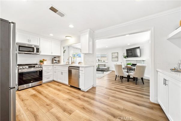 Dining room, Interior, Kitchen, Recessed Lighting, Stainless Steel Appliances, Wood Texture Flooring
