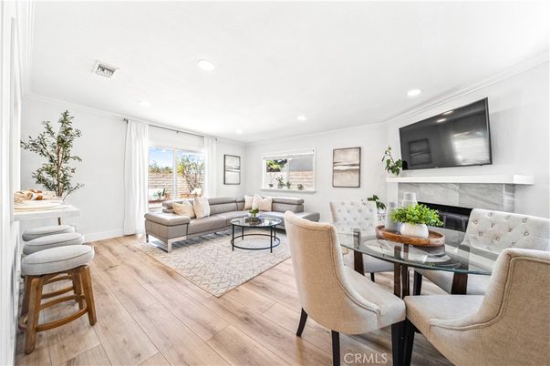 Dining room, Fireplace, Interior, Living room, Recessed Lighting, Wood Texture Flooring