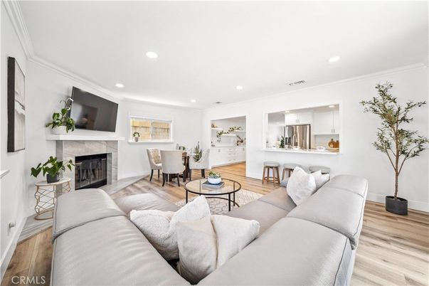 Dining room, Fireplace, Interior, Kitchen, Living room, Recessed Lighting, Stainless Steel Appliances, Wood Texture Flooring