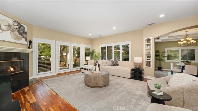 Chandelier, Dining room, Fireplace, Interior, Living room, Recessed Lighting, Wood Texture Flooring