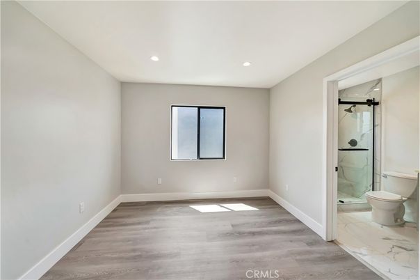 Bathroom, Empty room, Glass Shower, Interior, Marble, Recessed Lighting, Wood Texture Flooring
