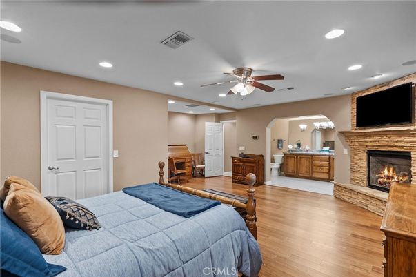 Bedroom, Fireplace, Interior, Recessed Lighting, Wood Texture Flooring