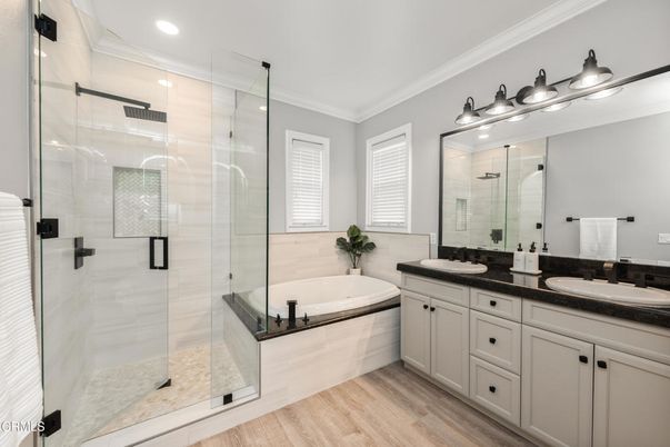 Bathroom, Dual Sink Vanities, Glass Shower, Interior, Recessed Lighting, Wood Texture Flooring