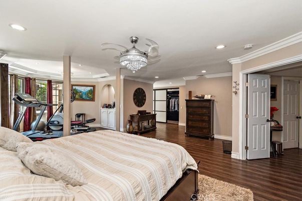 Bedroom, Chandelier, Fitness Equipment, Interior, Recessed Lighting, Wood Texture Flooring