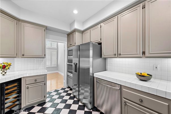 Interior, Kitchen, Recessed Lighting, Stainless Steel Appliances, Tile Countertops, Wood Texture Flooring