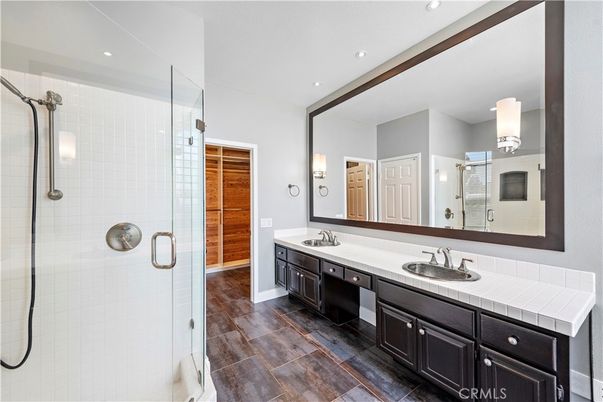 Bathroom, Dual Sink Vanities, Glass Shower, Interior, Recessed Lighting, Tile Countertops