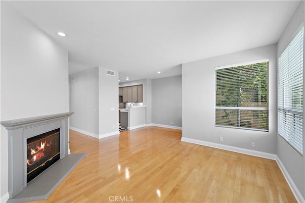 Empty room, Fireplace, Interior, Kitchen, Recessed Lighting, Wood Texture Flooring