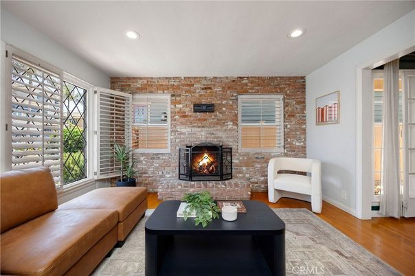 Fireplace, Interior, Living room, Recessed Lighting, Stone Walls, Wood Texture Flooring