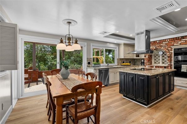 Dining room, Interior, Kitchen, Pendant Lights, Recessed Lighting, Stainless Steel Appliances, Stone Walls, Wood Texture Flooring