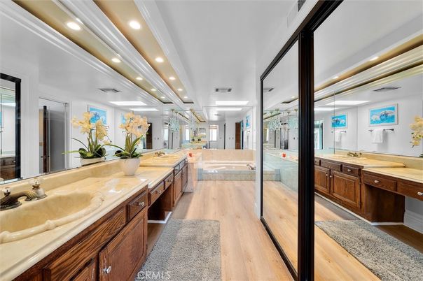 Bathroom, Dual Sink Vanities, Glass Shower, Interior, Recessed Lighting, Wood Texture Flooring
