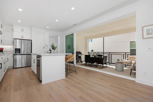 Dining room, Interior, Kitchen, Recessed Lighting, Stainless Steel Appliances, Wood Texture Flooring